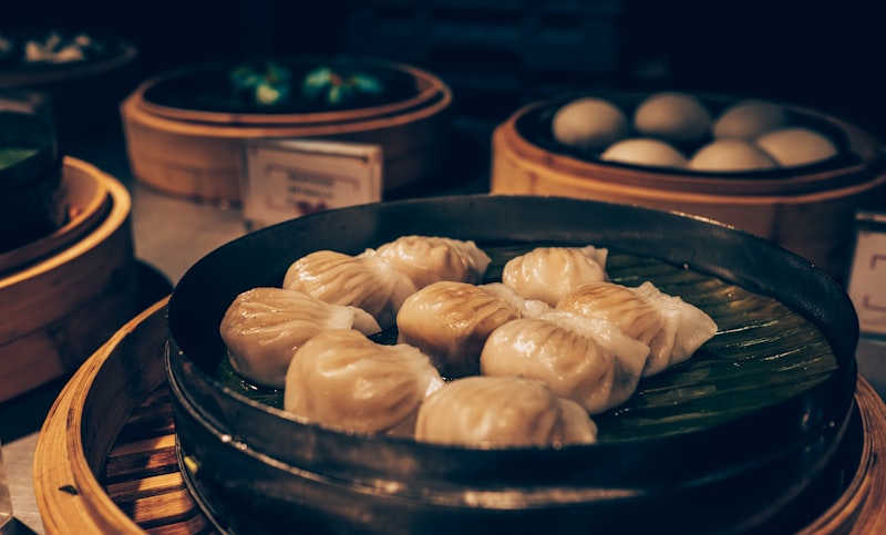 Steaming xiaolongbao in bamboo steamers — this could be your layover lunch